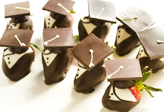 Chocolate covered strawberries decorated with chocolate graduation caps